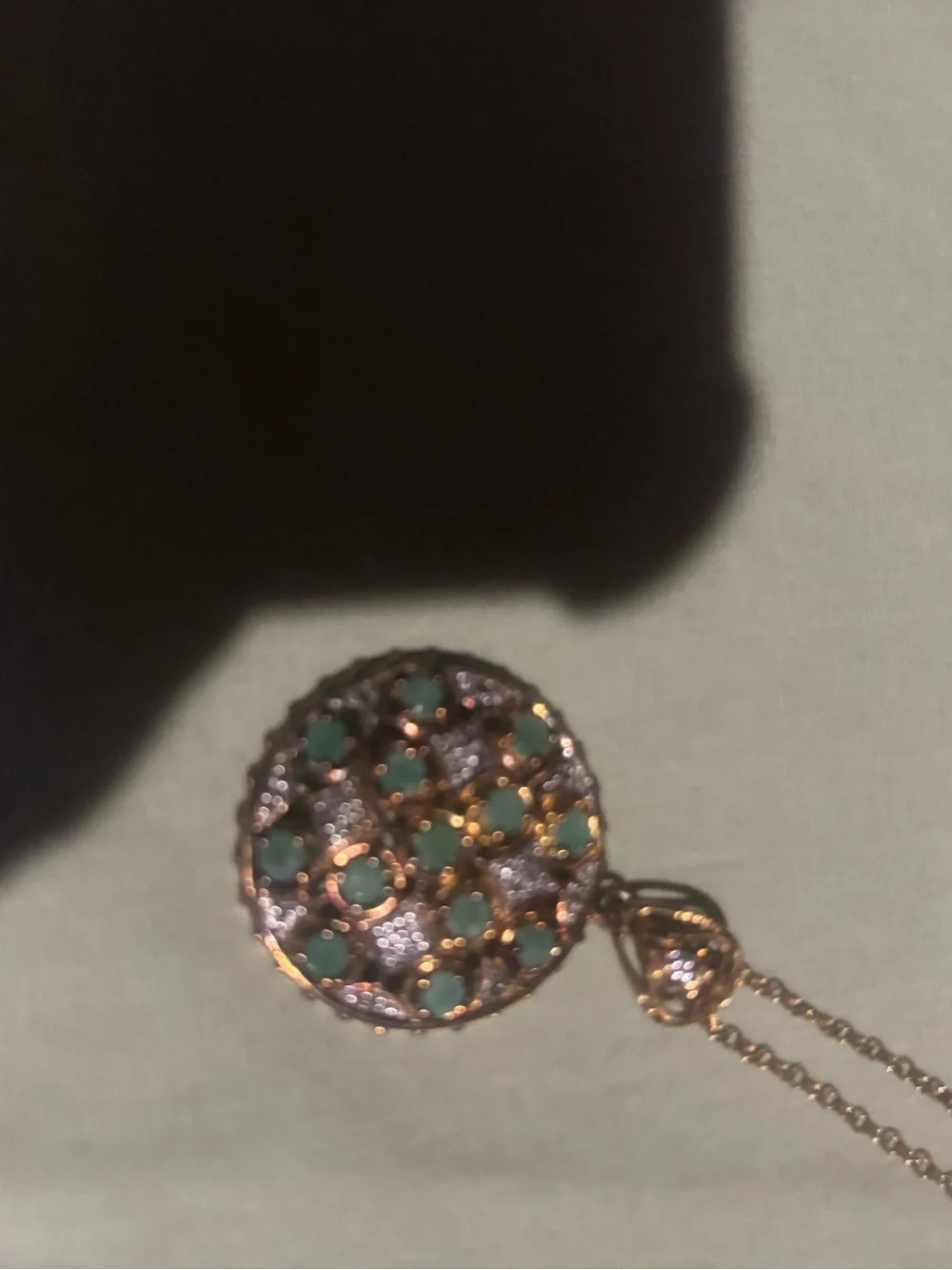 Gold chain with gold charm. Green and clear stones! Beautiful piece!